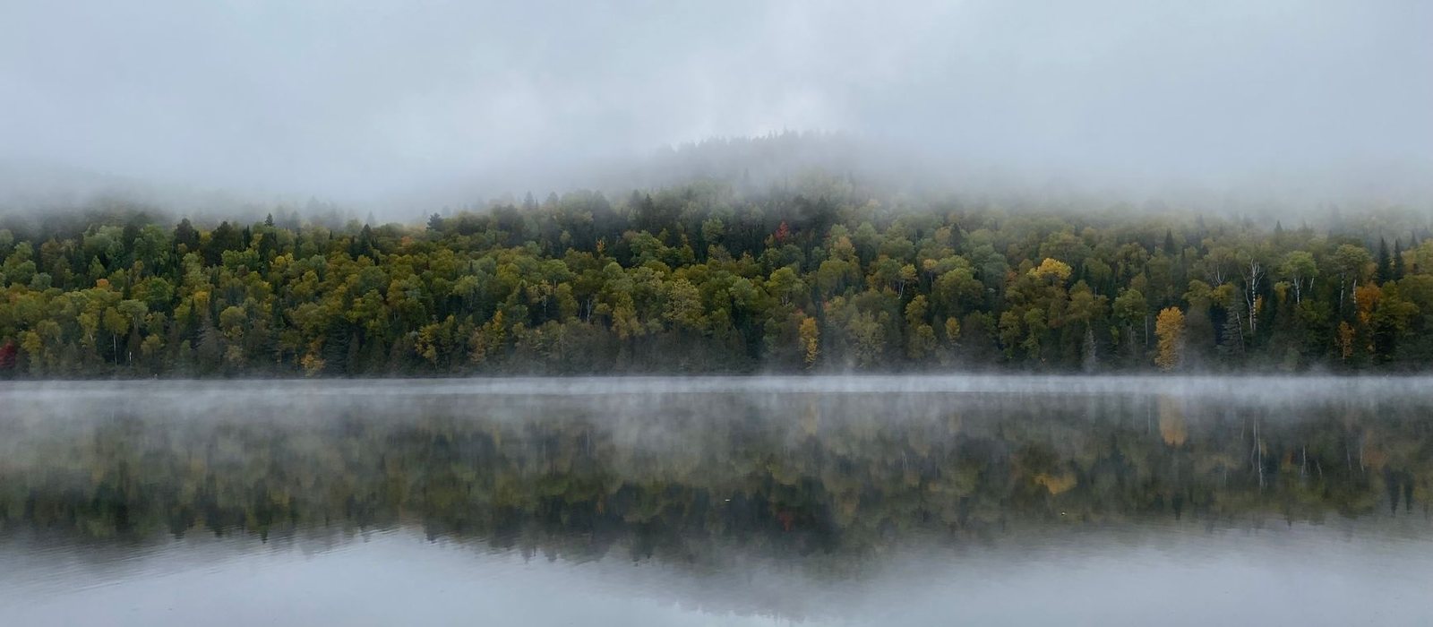 Calm lake at sunrise in Canada